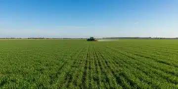 Vast green agricultural field with a modern tractor, symbolizing the future of farming.