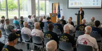 Veterans attending a seminar on benefits updates, focused and engaged.